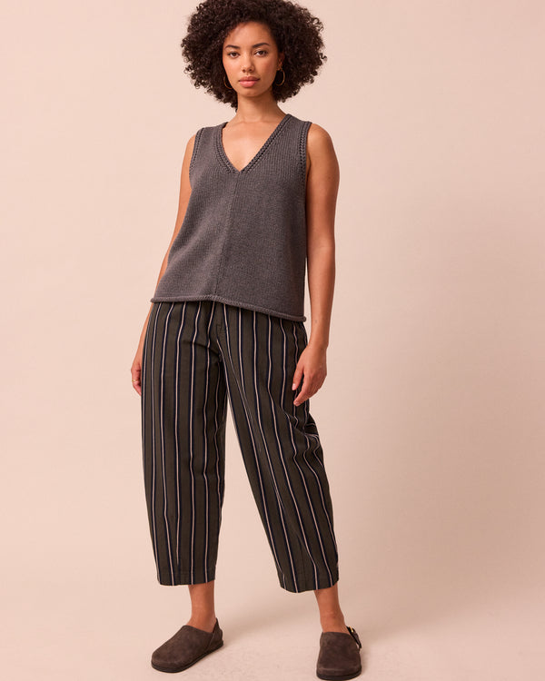 model wears remi dark fern stripe denim jeans right