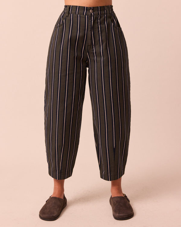 model wears remi dark fern stripe denim jeans front