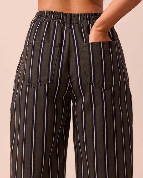 model wears remi dark fern stripe denim jeans