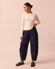 model wears remi indigo rinse wash denim trousers right