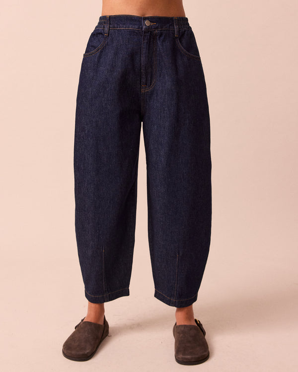 model wears remi indigo rinse wash denim jeans front