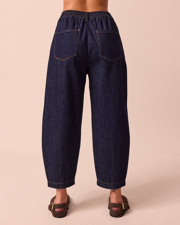 model wears remi indigo rinse wash denim jeans back