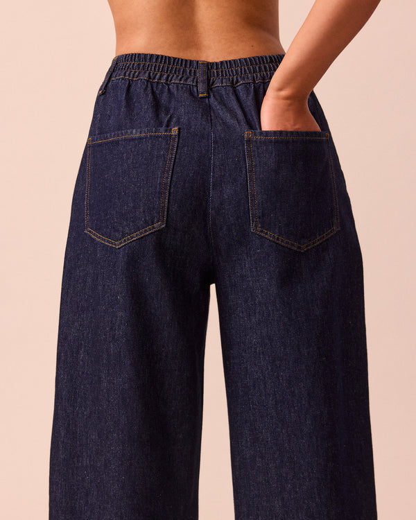 model wears remi indigo rinse wash denim jeans