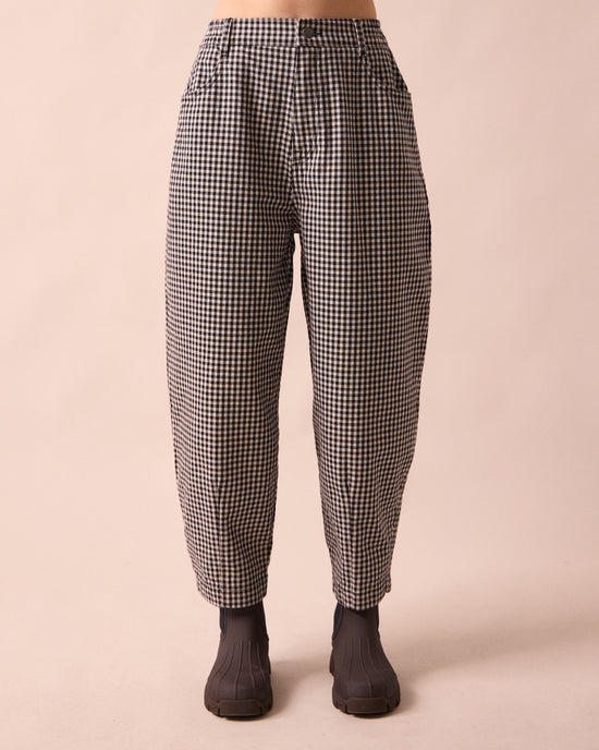 model wears remi black and white mini gingham denim jeans front