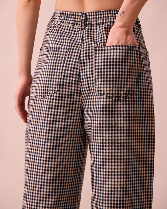 model wears remi black and white mini gingham denim jeans