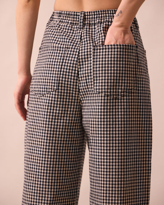 model wears remi black and white mini gingham denim jeans