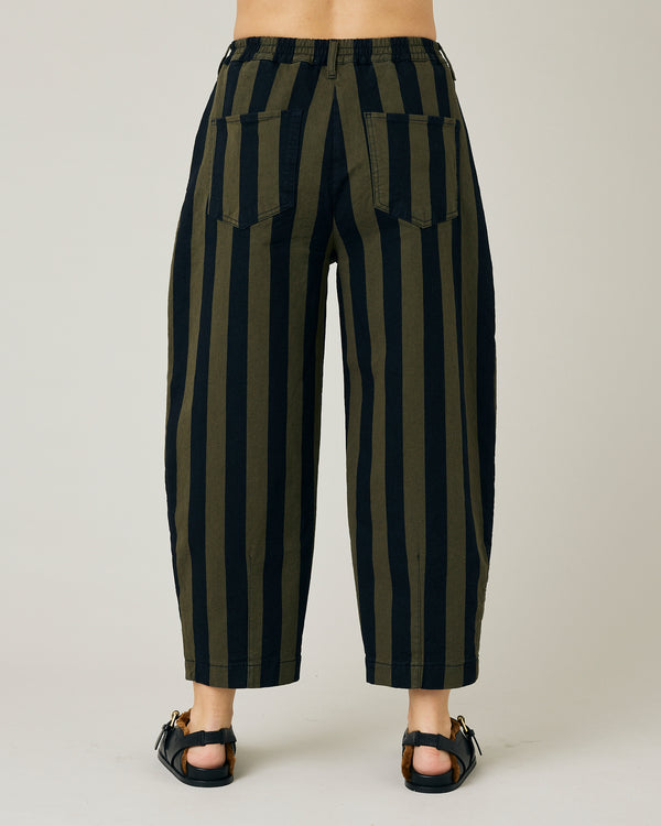 pregnant model wears black and olive remi denim trousers 