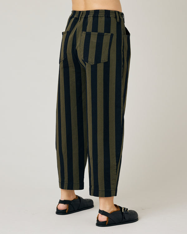 pregnant model wears black and olive remi denim trousers 