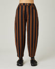 model wears black and rust stripe remi jeans 