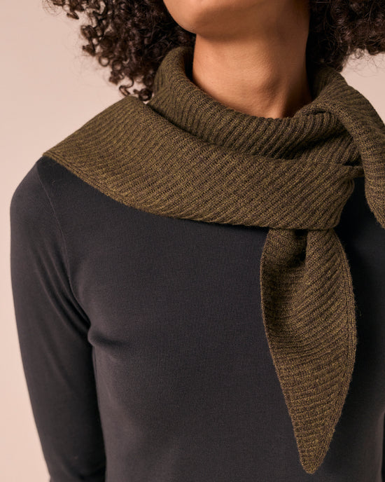 model wears ribbed knitted dark forest neckerchief