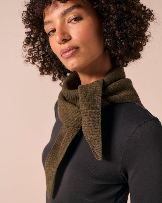 model wears ribbed knitted dark forest neckerchief
