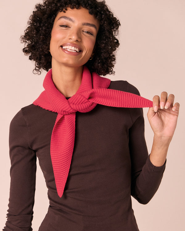 model wears ribbed rhubarb knitted neckerchief