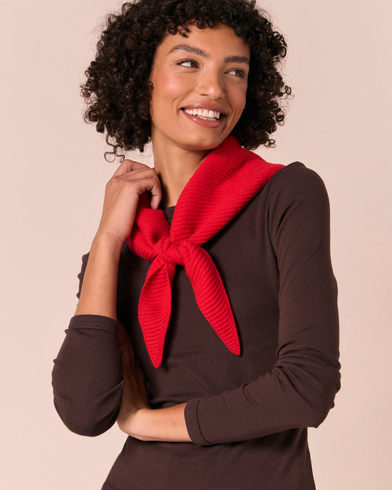 model wears ribbed knitted poppy red neckerchief