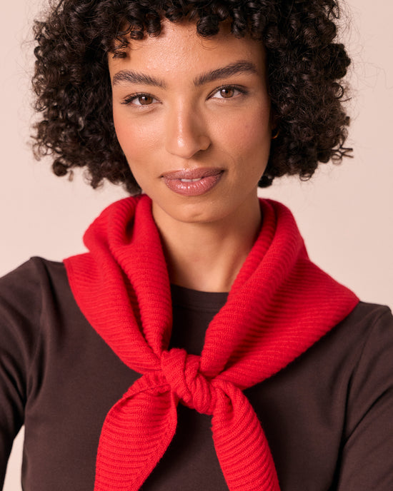 model wears ribbed knitted poppy red neckerchief
