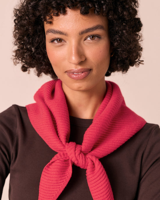 model wears ribbed rhubarb knitted neckerchief
