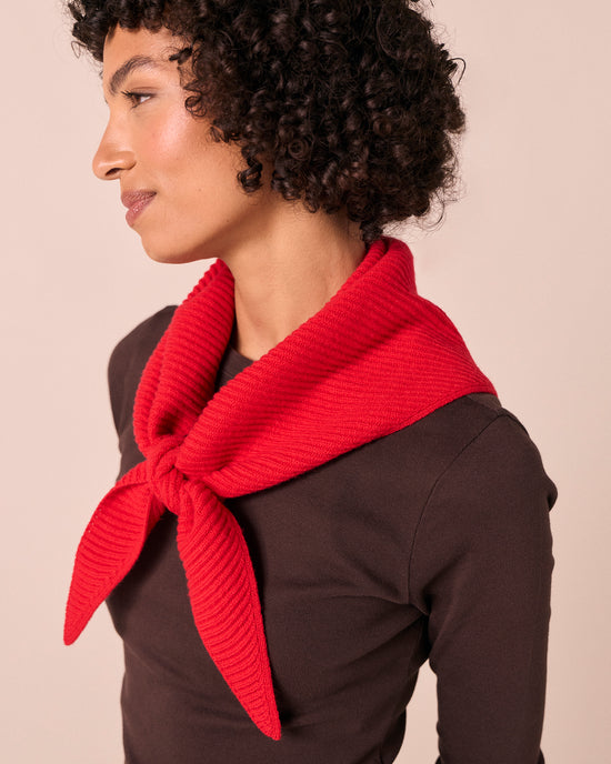 model wears ribbed knitted poppy red neckerchief