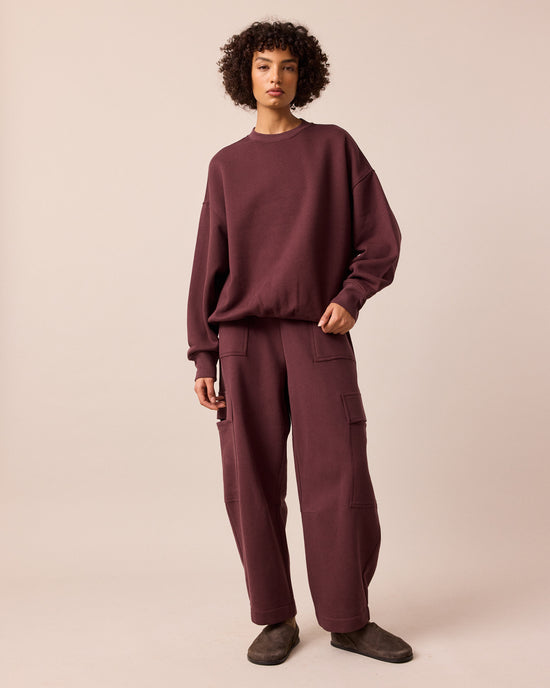 model wears riley burgundy jersey jumper