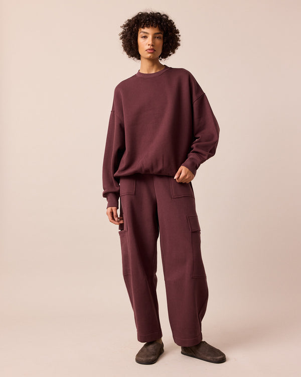 model wears riley burgundy jersey jumper