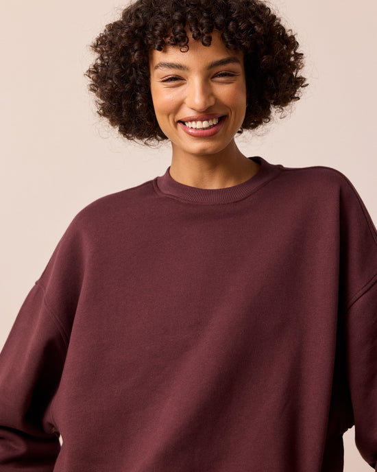 model wears riley burgundy jersey jumper