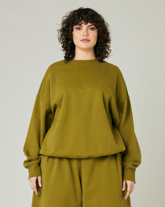 model wears olive green jersey riley jumper