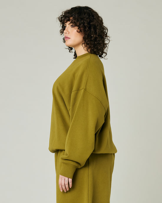 model wears olive green jersey riley jumper