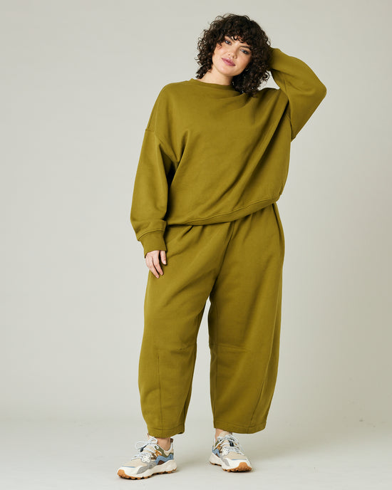 model wears olive green jersey riley jumper