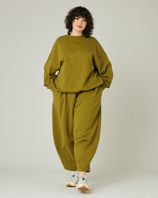 model wears olive green jersey riley jumper