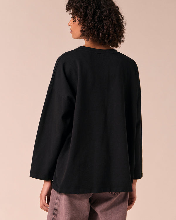 model wears robyn black jersey top