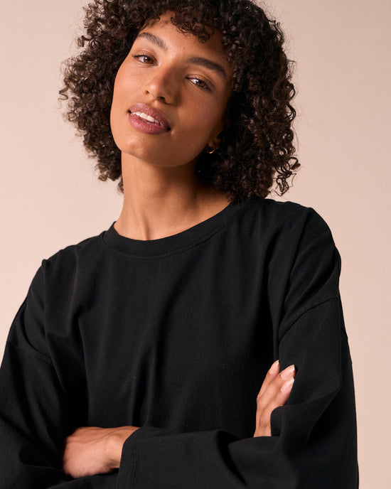 model wears robyn black jersey top