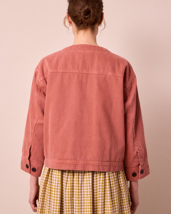 model wears rosa clay pink denim jacket