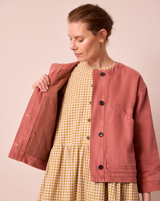model wears rosa clay pink denim jacket