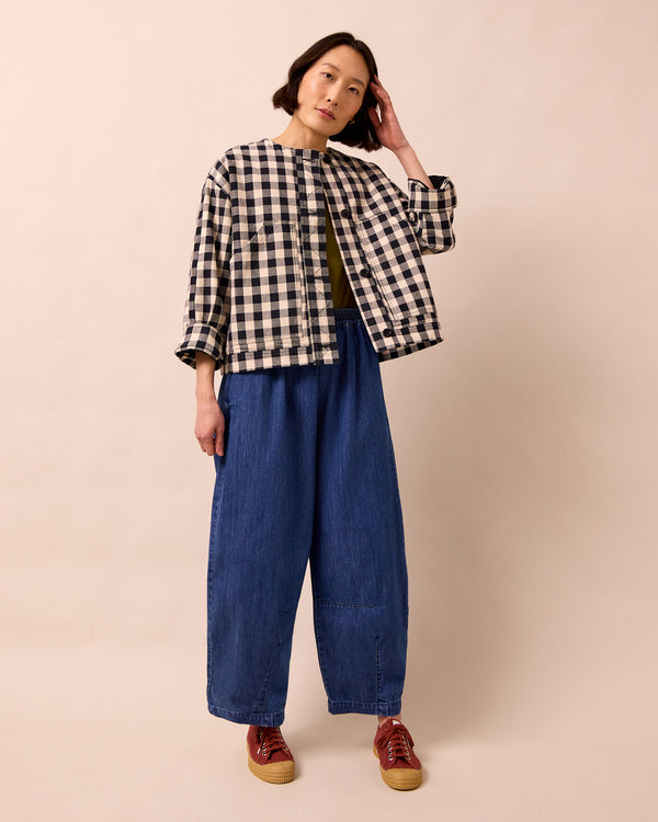 model wears rosa black and white check denim jacket