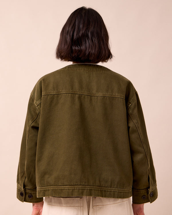 model wears rosa olive denim jacket