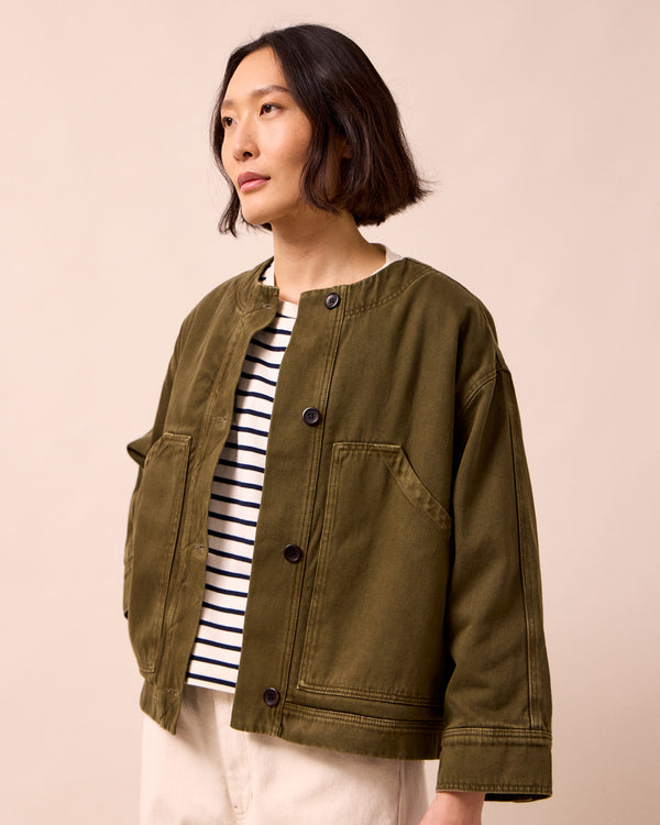 model wears rosa olive denim jacket