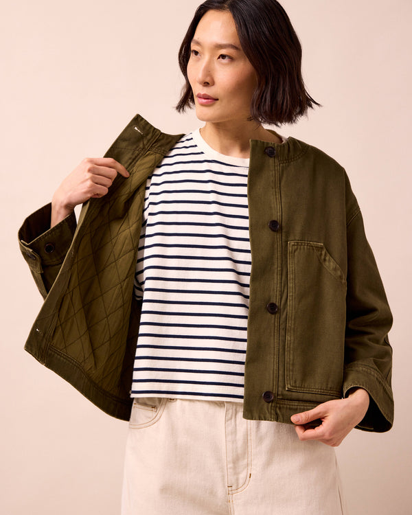 model wears rosa olive denim jacket