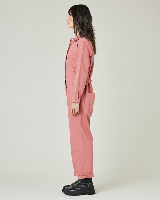 model wears rose denim coverall