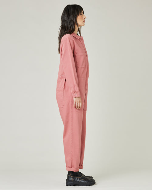 model wears rose denim coverall