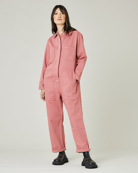 model wears rose denim coverall