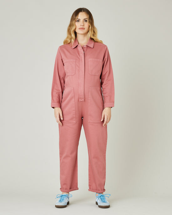 pregnant model wears rose denim coverall