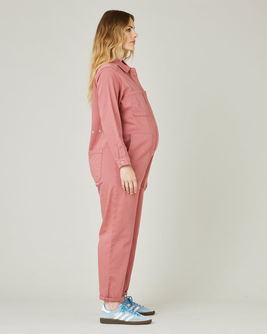 pregnant model wears rose denim coverall