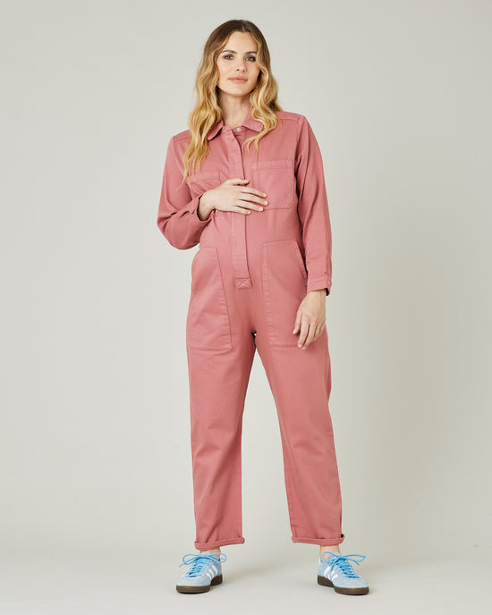 pregnant model wears rose denim coverall