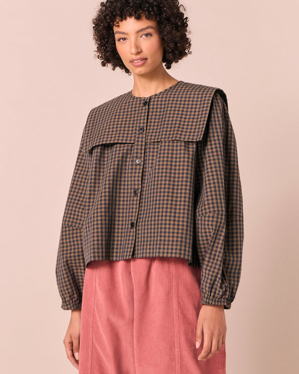 model wears rowen fern gingham cotton poplin top