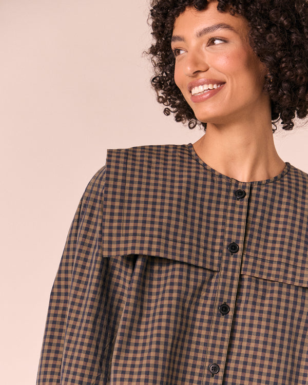 model wears rowen fern gingham cotton poplin top