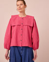 model wears rowen raspberry stripe seersucker top