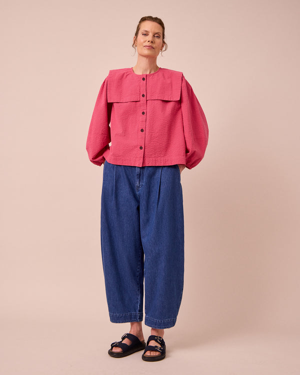 model wears rowen raspberry stripe seersucker top