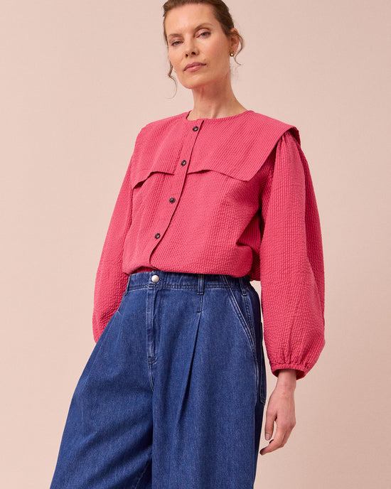 model wears rowen raspberry stripe seersucker top