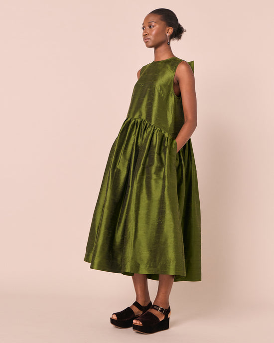 model wears roxy jewel green silk dupion dress