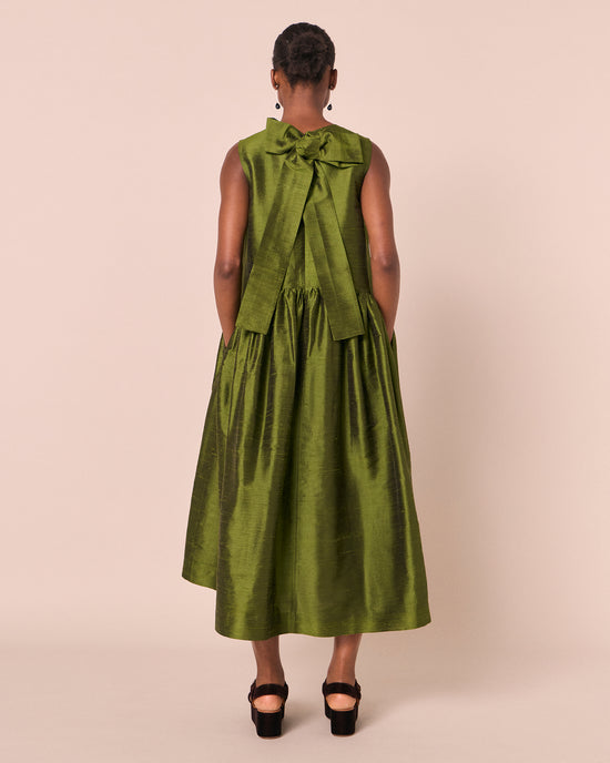 model wears roxy jewel green silk dupion dress