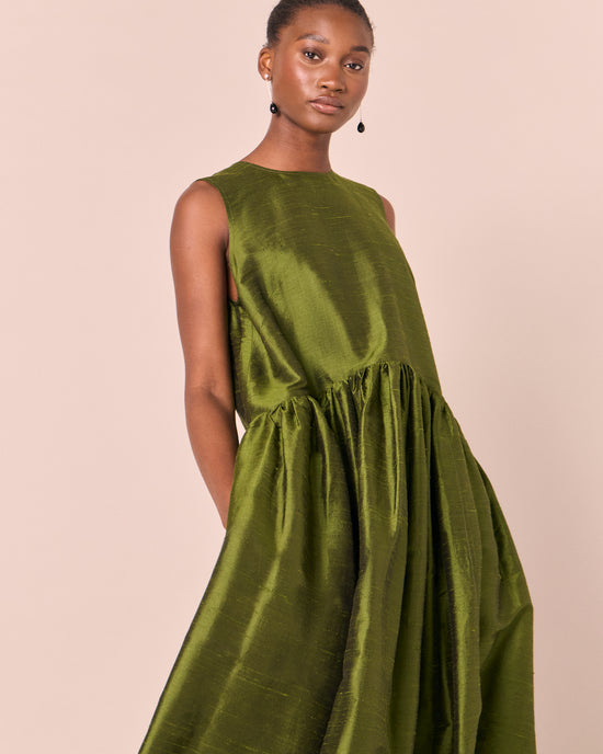model wears roxy jewel green silk dupion dress
