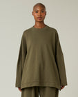 model wears olive jersey taylor top